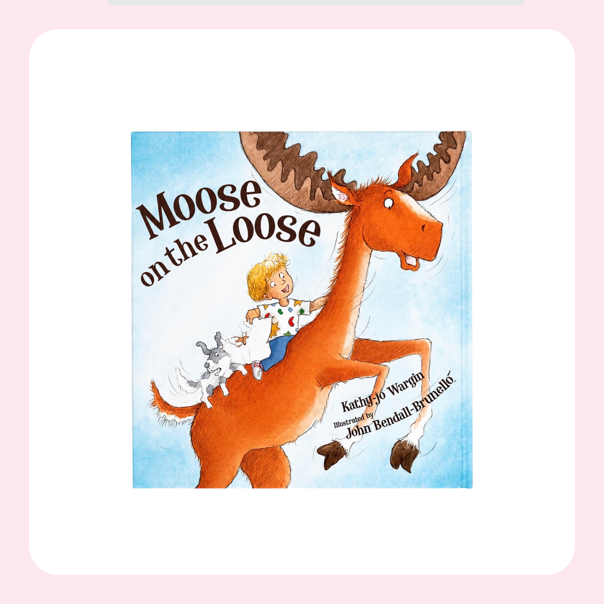 Children's book cover for 'Moose on the Loose' by Kathryn Jo Wargle and John Bertrand-Brudnits, featuring an illustration of a child riding a large orange-brown moose against a light blue sky. The book is centered on a white rounded square with a soft pink border.