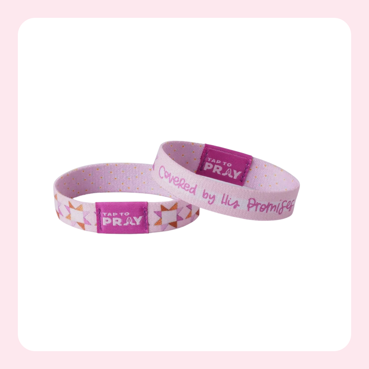 Two pink silicone wristbands with gold polka dots and a magenta center label that reads 'TAKE TO PRAY'. One wristband has a geometric pattern on the left side, and the other has the phrase 'Covered by His Promises' in white script.