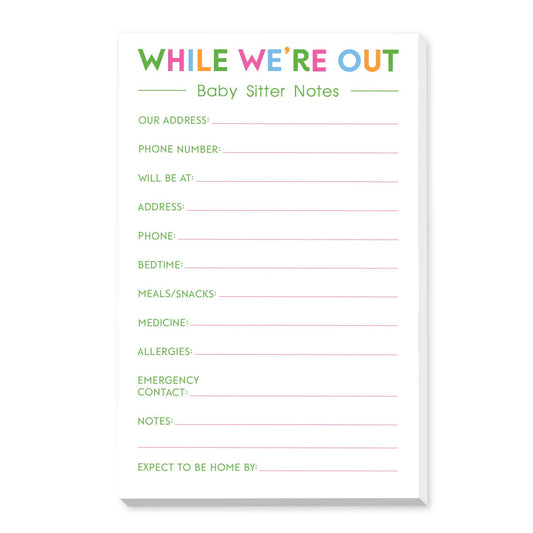 A baby sitter notes pad with a white cover featuring colorful text that reads 'WHILE WE'RE OUT' and various printed fields in green and pink, shown on a clean white background.