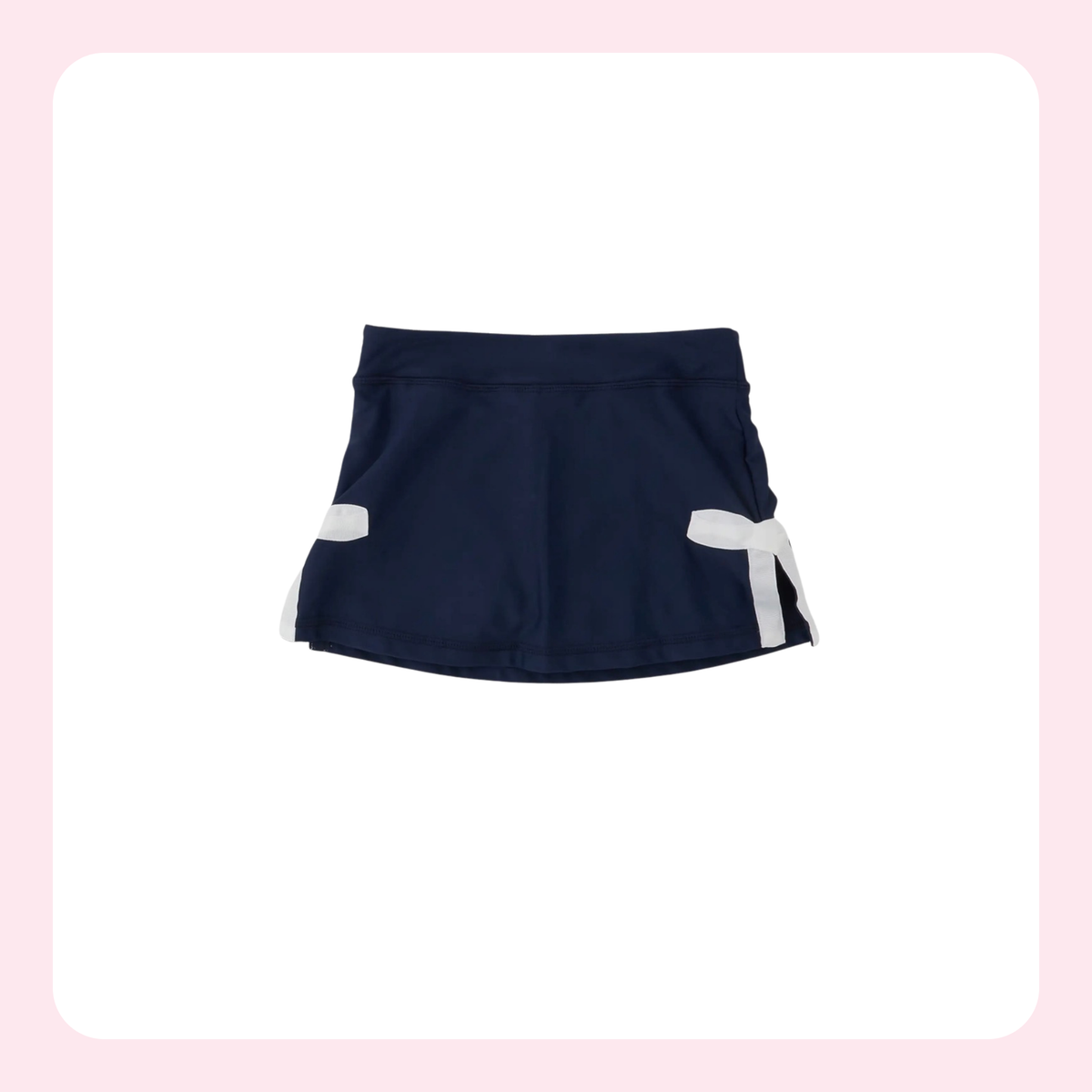 A navy blue athletic skirt with white side accents and a white bow detail on the right side, displayed against a white background with a light pink border.