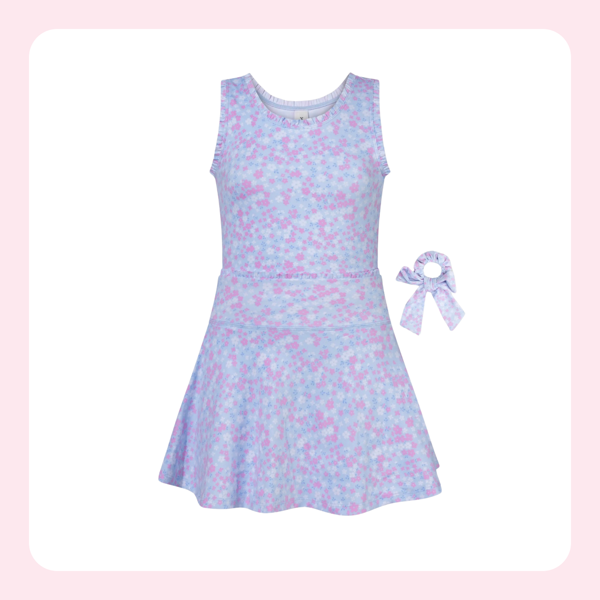 A sleeveless girls' dress in a pastel blue and pink floral print, shown with a matching fabric hair bow accessory on a white background with a light pink border.