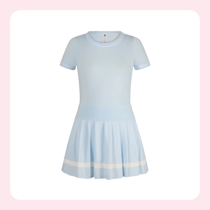 A light blue short-sleeve dress with a pleated skirt and a horizontal cream stripe near the hem, shown against a white background with a soft pink border.