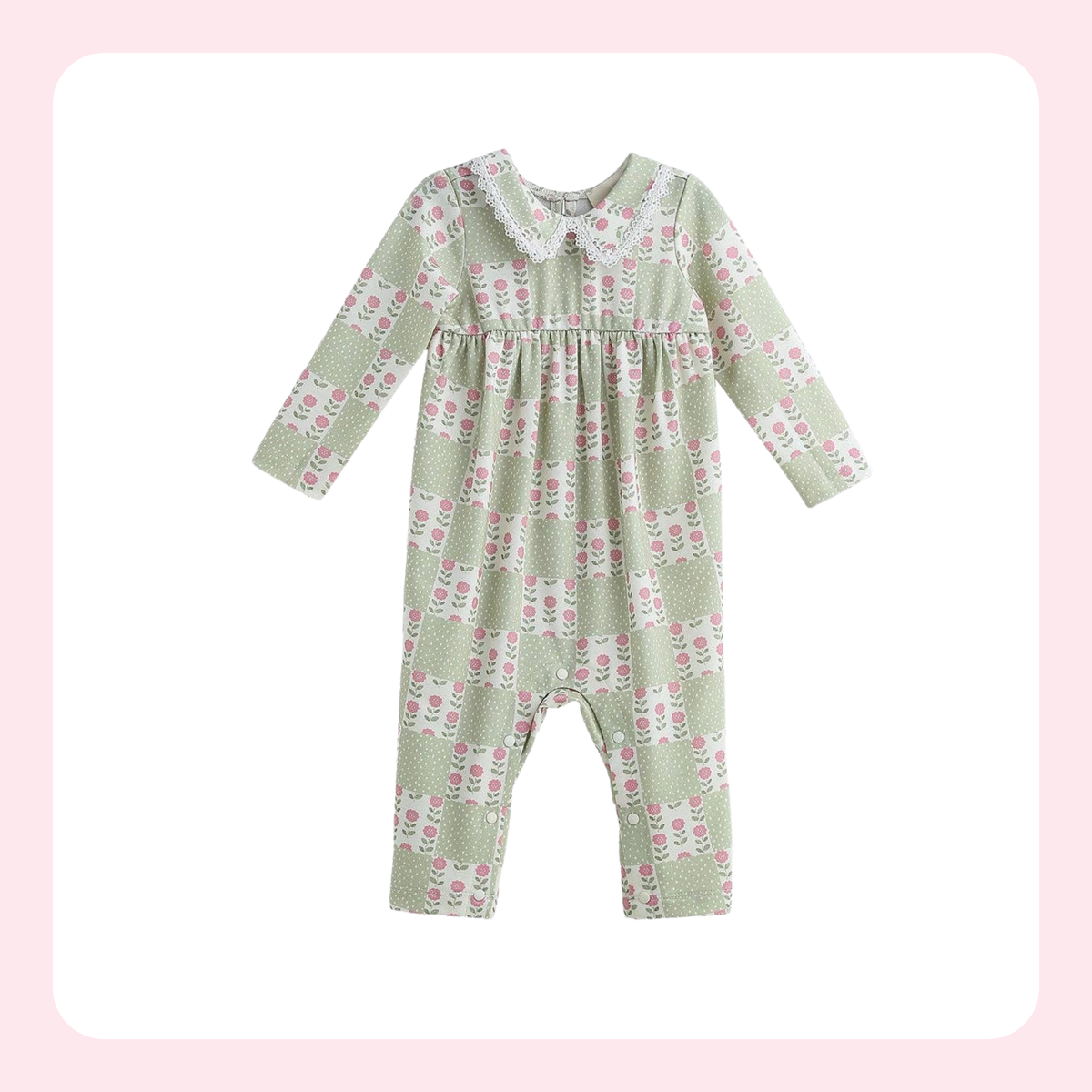 A baby long-sleeve romper in sage green with a pink and white floral pattern, featuring a Peter Pan collar and a smocked chest detail, shown on a white background with a soft pink border.